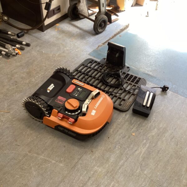 Worx Landroid robotic lawn mower with charging base.