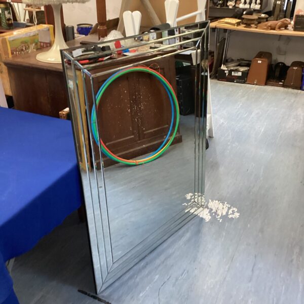 Large mirrored framed wall mirror for home decor, vintage style.