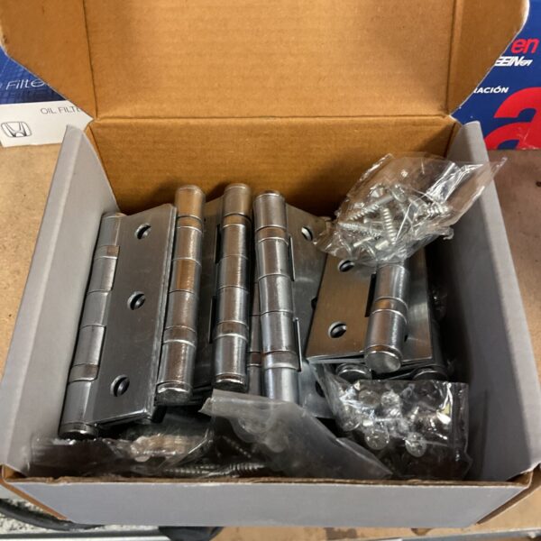 Lot of fourteen vintage metal door hinges with screws.