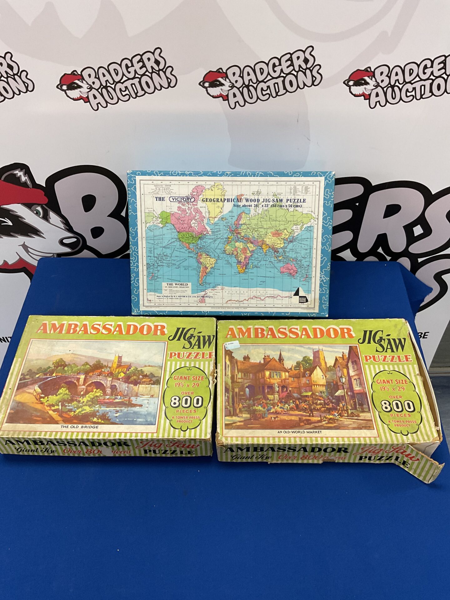319 Three vintage jigsaw puzzles including ambassador