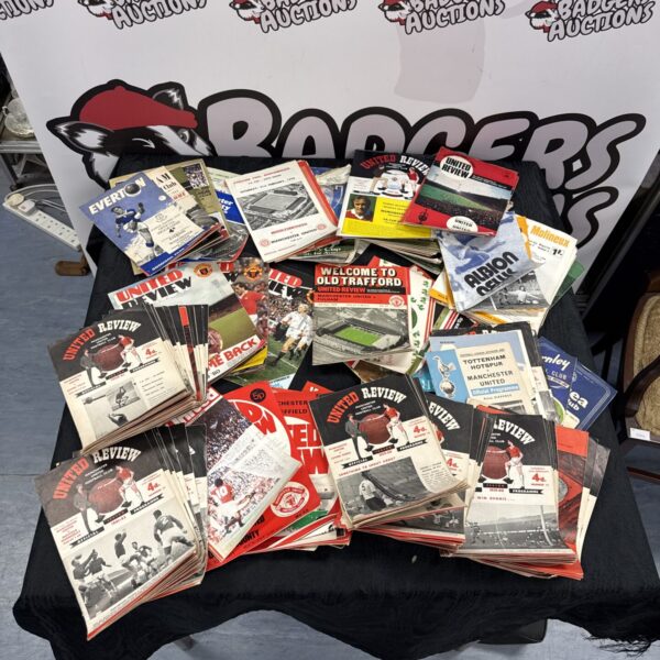 Vintage Manchester United football programs from the 1960s and 70s.