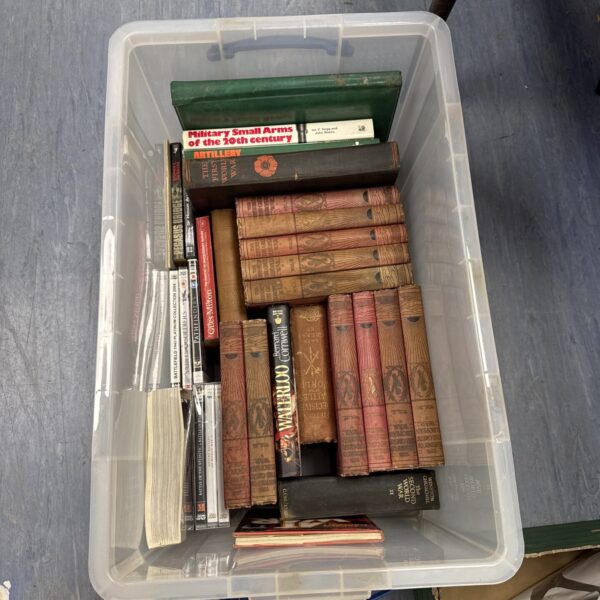 Large lot of vintage military books and DVDs for collectors.