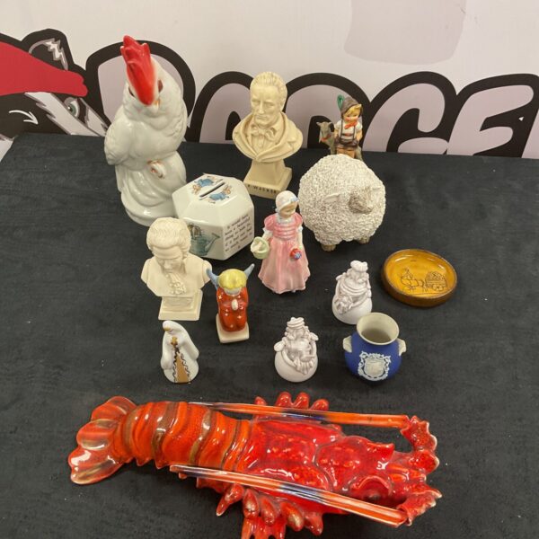 Mixed china collection featuring a lobster and figurines.