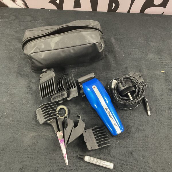Babyliss hair trimmer with various attachment combs for versatile grooming.