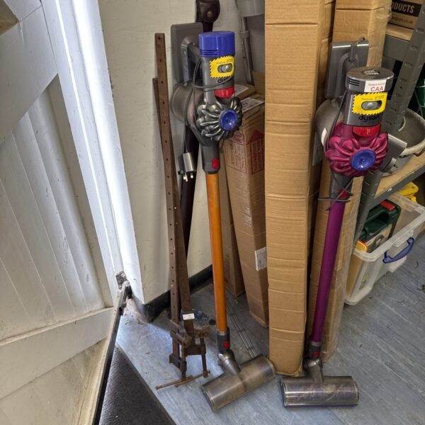Used Dyson V8 Absolute cordless vacuum cleaner in a home setting.
