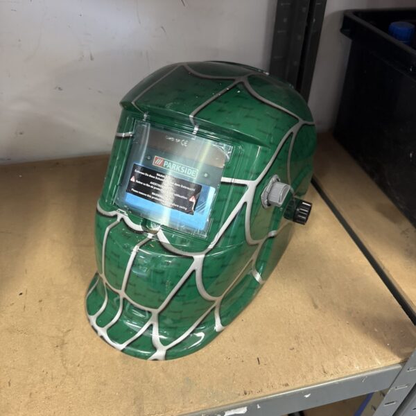 Front view of a green Parkside welding mask for workshop safety.