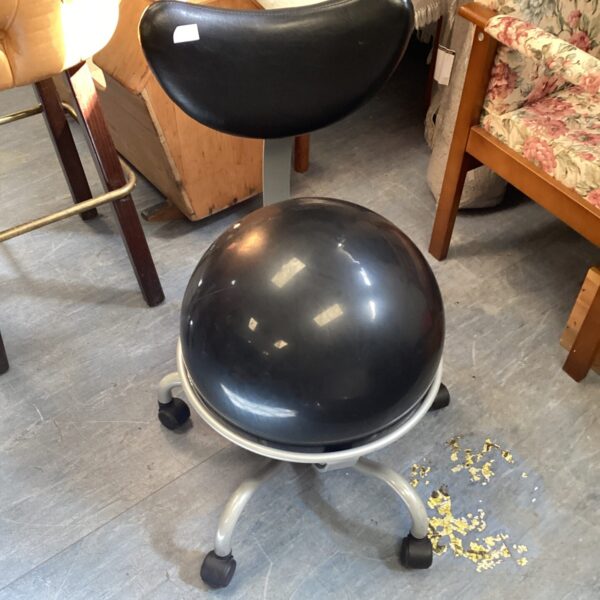Vintage birthing chair with adjustable height and swivel base.