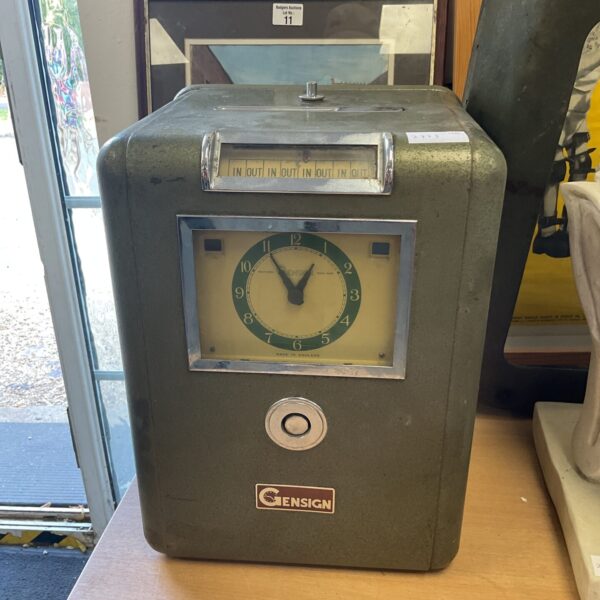 Vintage Ensign clocking in machine for recording employee time.