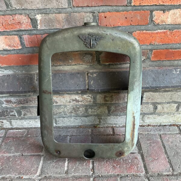 Vintage Austin 7 radiator surround with badge, classic car part.