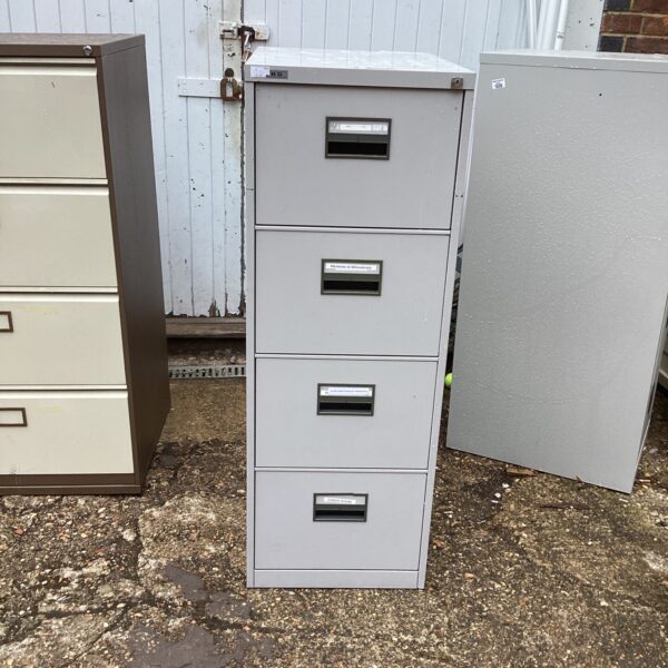 Vintage metal filing cabinet with four drawers, ideal for office storage.