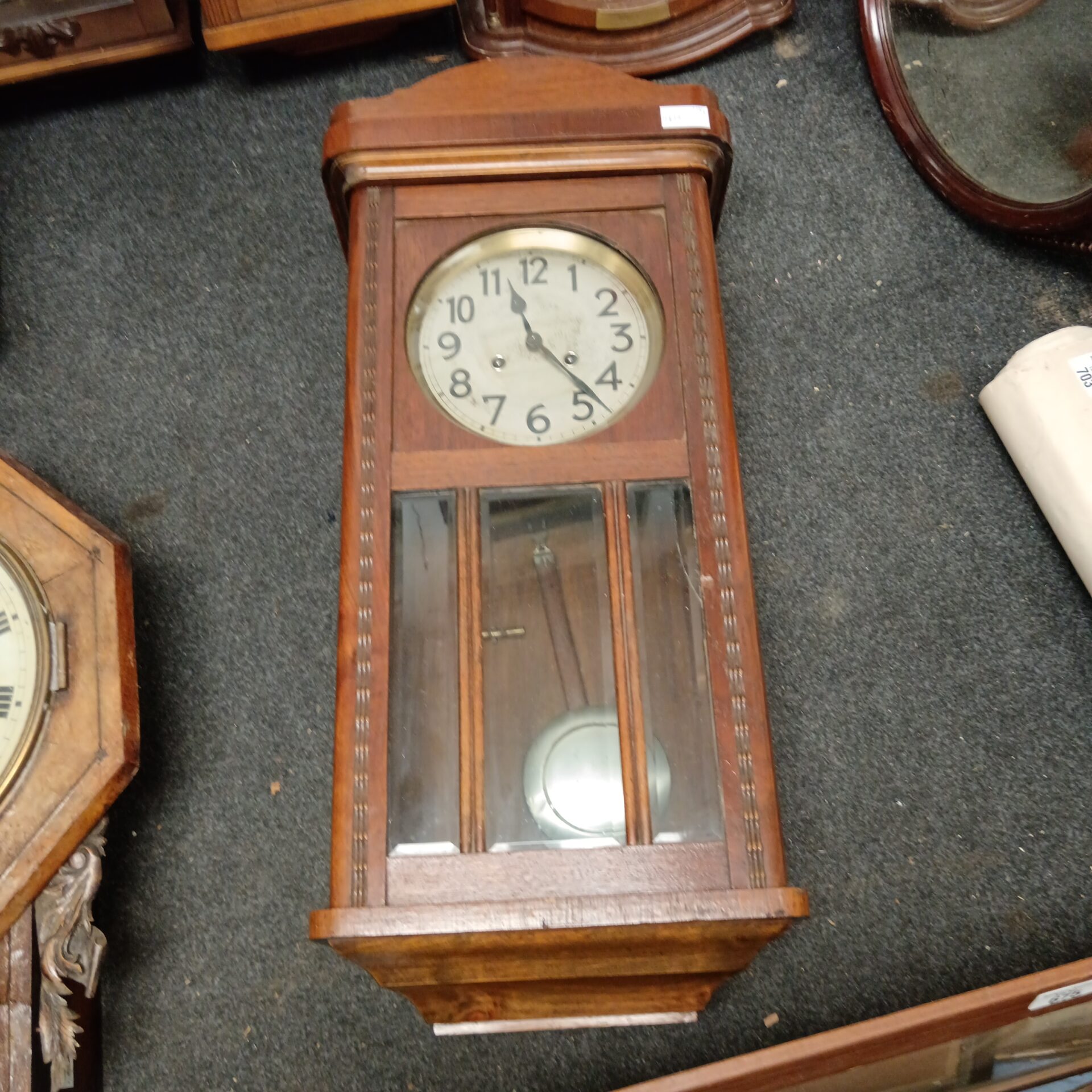 687 Vintage oak cased wall clock with pendulum & key