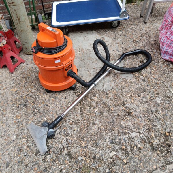 Vax wet and dry vacuum cleaner with hose attachment.