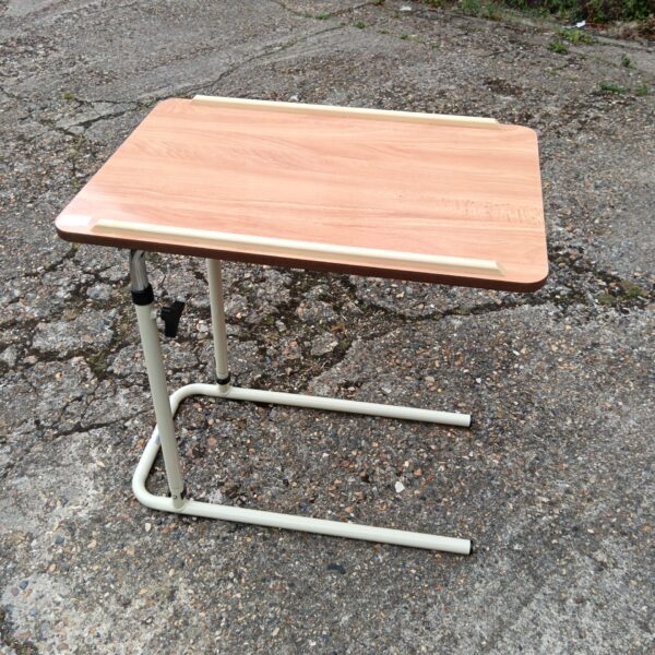 Adjustable performance health overbed table for bedside use.