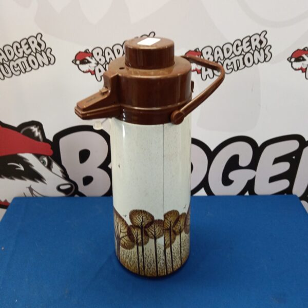Vintage Pheonix pump action thermos with woodland scene.