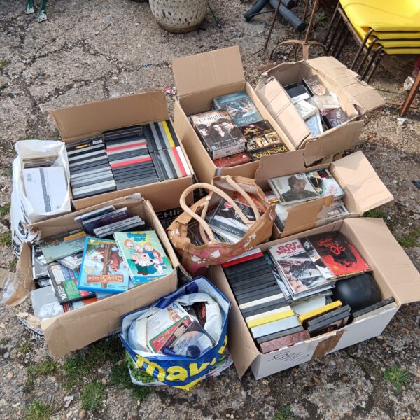 Large joblot of audio cassettes, CDs, and VHS tapes for collectors.