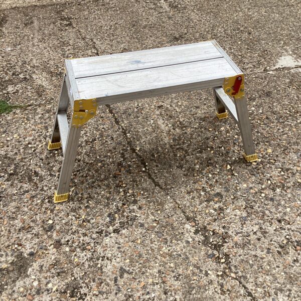 Silver aluminium decorating step with folding legs.