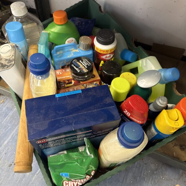Assorted shed clearance chemicals in a cardboard box.