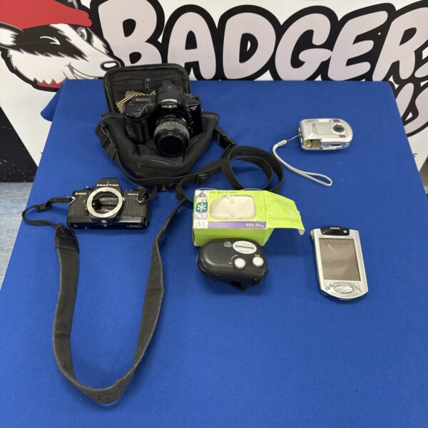 Vintage camera lot including Minolta and Praktica cameras.