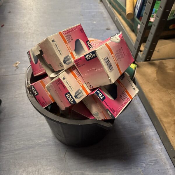Bucket of mixed light bulbs including Osram 100W filament bulbs.