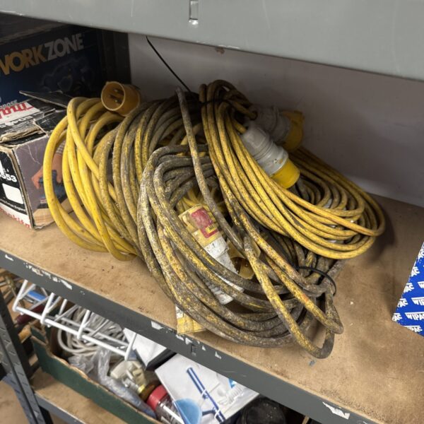 Bundle of used extension cables for DIY and electrical projects.