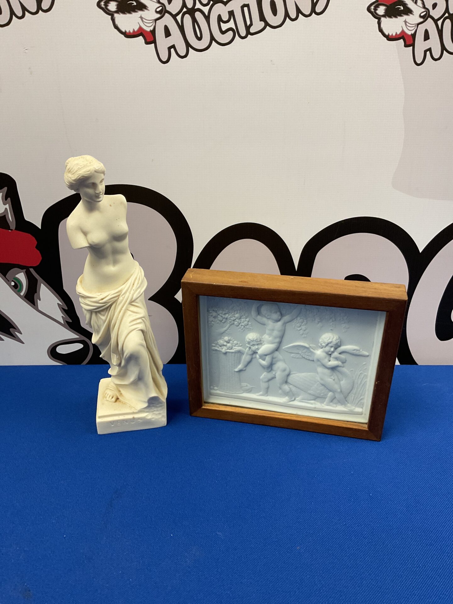 040 9.5” tall sculpture of venus & framed ceramic cherub tile