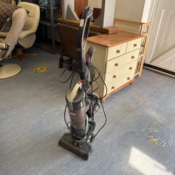 Hoover H-Lift 700XL upright vacuum cleaner in a home setting.