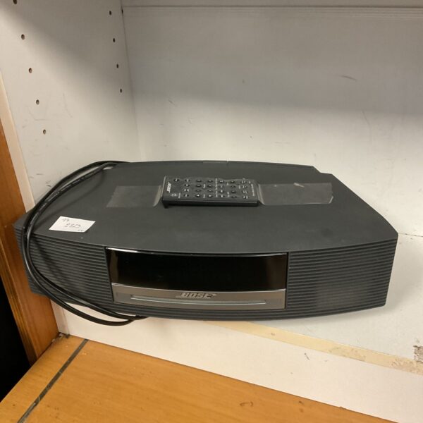 Vintage Bose Wave CD music system with remote control.
