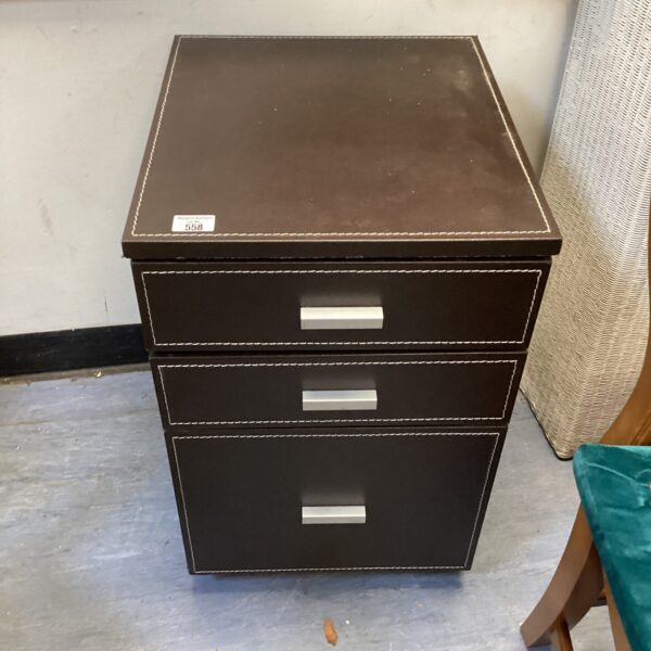 Dark brown leather under desk cabinet with three drawers.