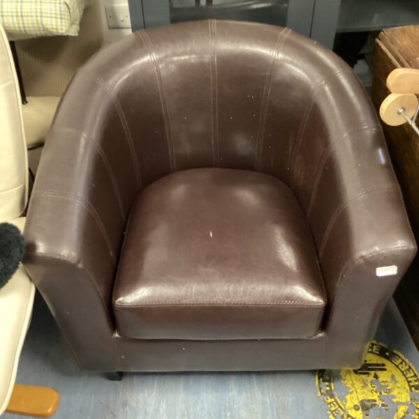 Vintage brown leather tub chair, comfortable seating.
