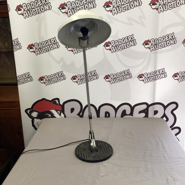 Vintage Anglepoise lamp with adjustable arm and conical shade.