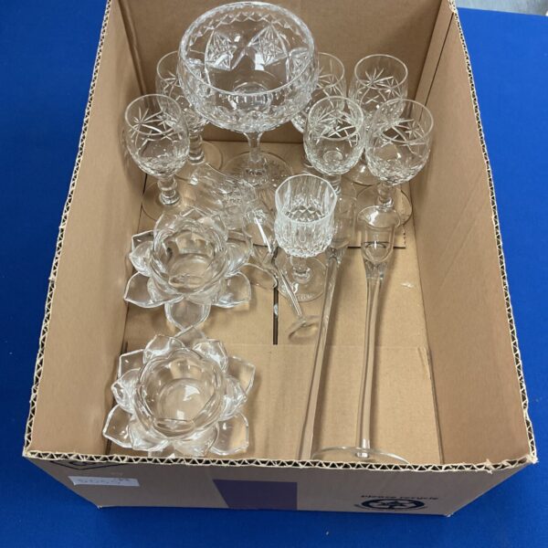 Selection of vintage cut glass glassware including sherry glasses and a goblet.