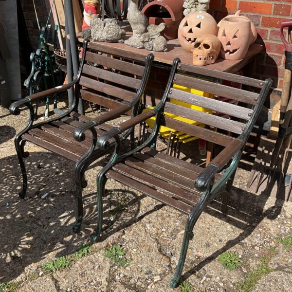 Pair of vintage garden chairs with cast iron details.