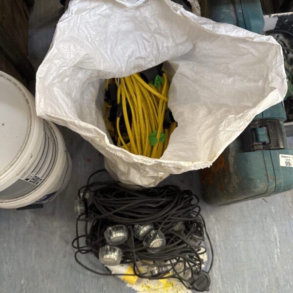Two reels of festoon lights, one LED, for garden or event lighting.