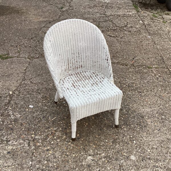 Vintage Lloyd Loom chair with woven seat and back.