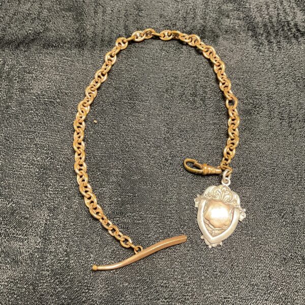 Antique Victorian Albert fob chain with silver and gold details.