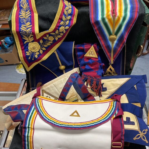 Detailed view of a Masonic regalia set inside a leather carrying case.