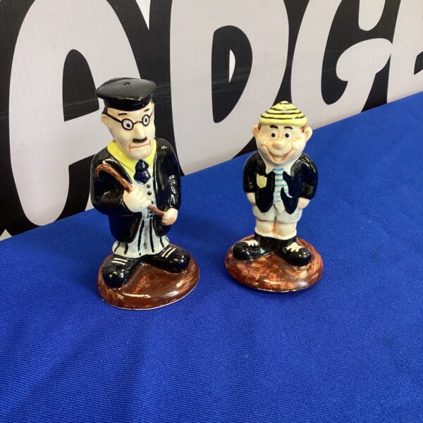 Vintage HP CC salt and pepper pots with character design.