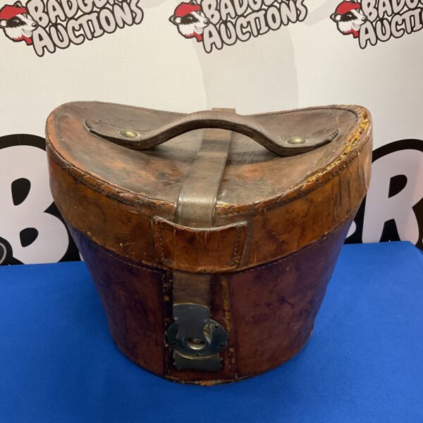 Antique leather top hat box with a dark brown finish.