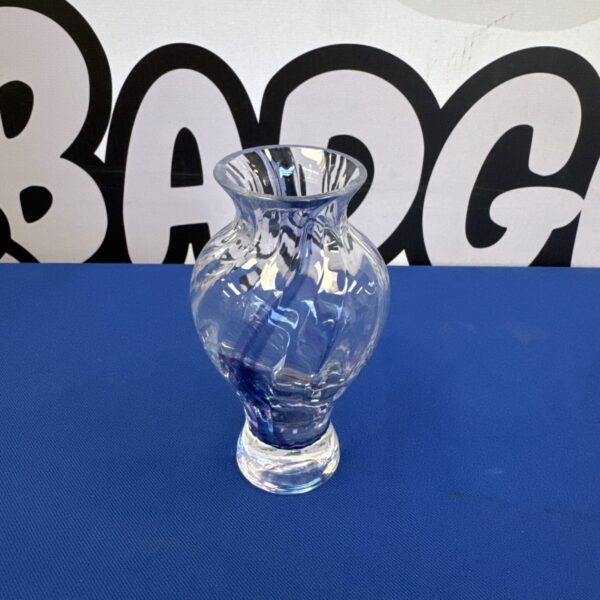 Small violet glass twist vase for decorative display.