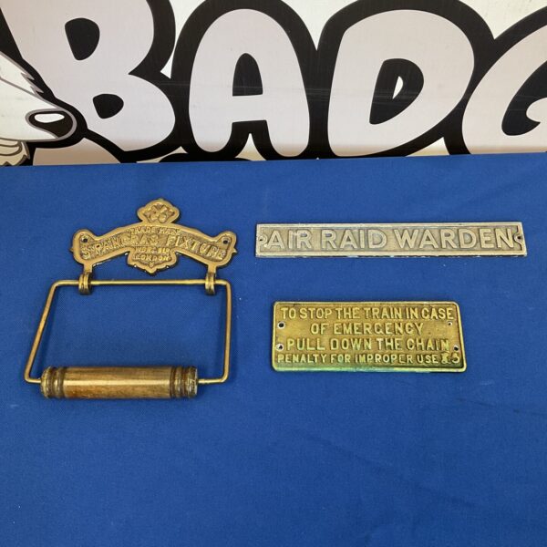 Vintage St Pancras loo roll holder with "Stop The Train" and "Air Raid Warden" plaques.