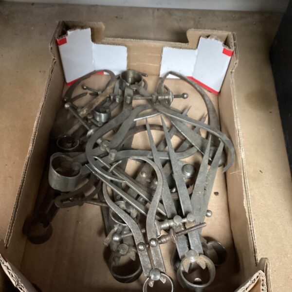 Selection of vintage engineering calipers for measuring and workshop use.