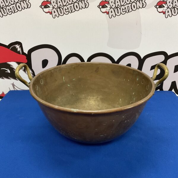 Large antique copper bowl with sturdy brass handles.