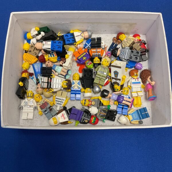Assorted LEGO minifigure lot with various themes and accessories.