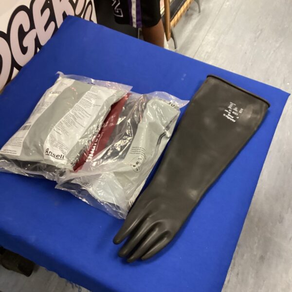 Two pairs of used Alphatec industrial gloves for work and safety.