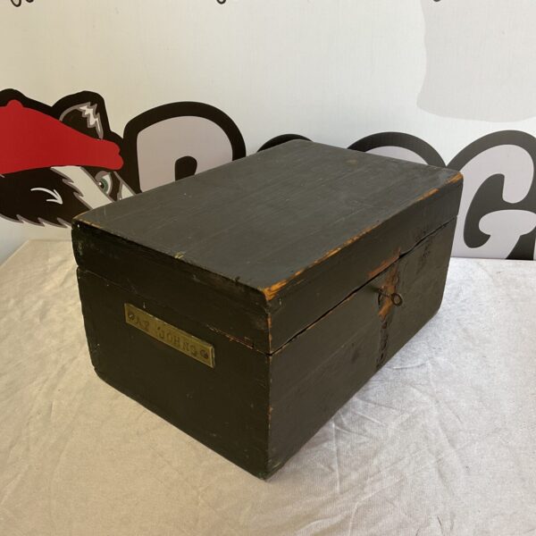 Vintage wooden lock box with "af johns" inscription and key.