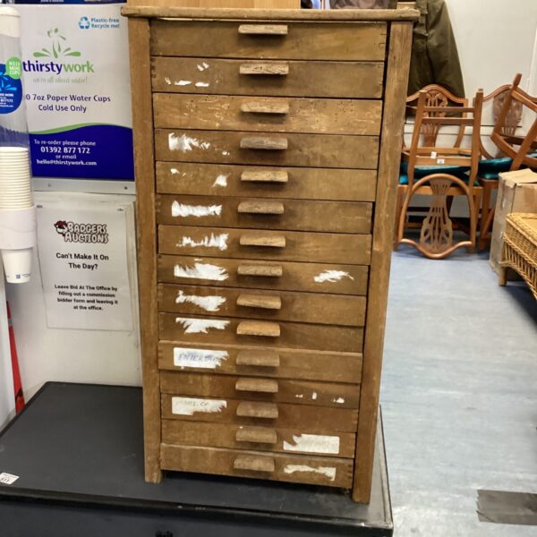Front view of vintage wooden engineers drawers for plans.