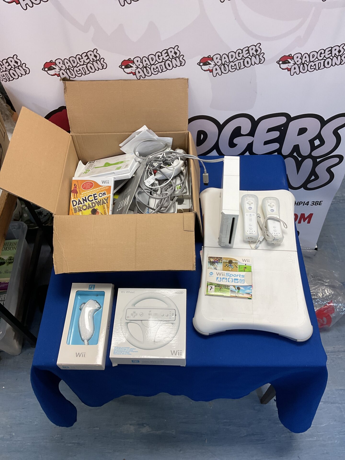 116 Nintendo wii console with two remotes, in box nunchucks, wii fit board and assorted games