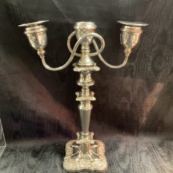 Vintage silverplate three-branch candelabra for elegant home decor.