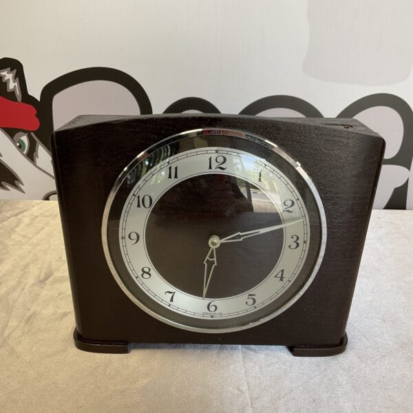 Vintage Smiths money box mantle clock with dark wood case.