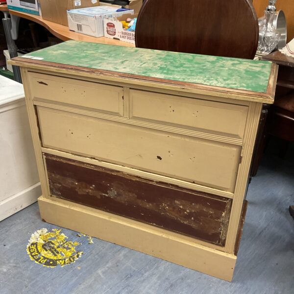 Front view of antique wooden chest of drawers for restoration.